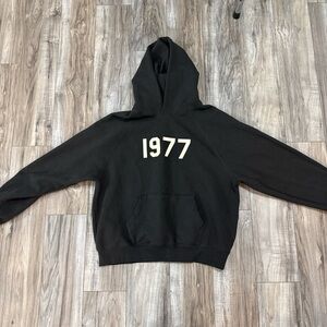 Fear of God Essentials hoodie. color is iron. never worn. size men’s medium